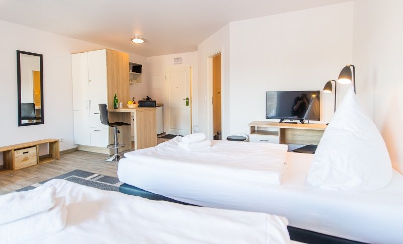 [Translate to English:] Hotel Flensburg Akademie – Doppelzimmer mit Doppelbett